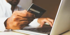 Man using credit card to make payment online